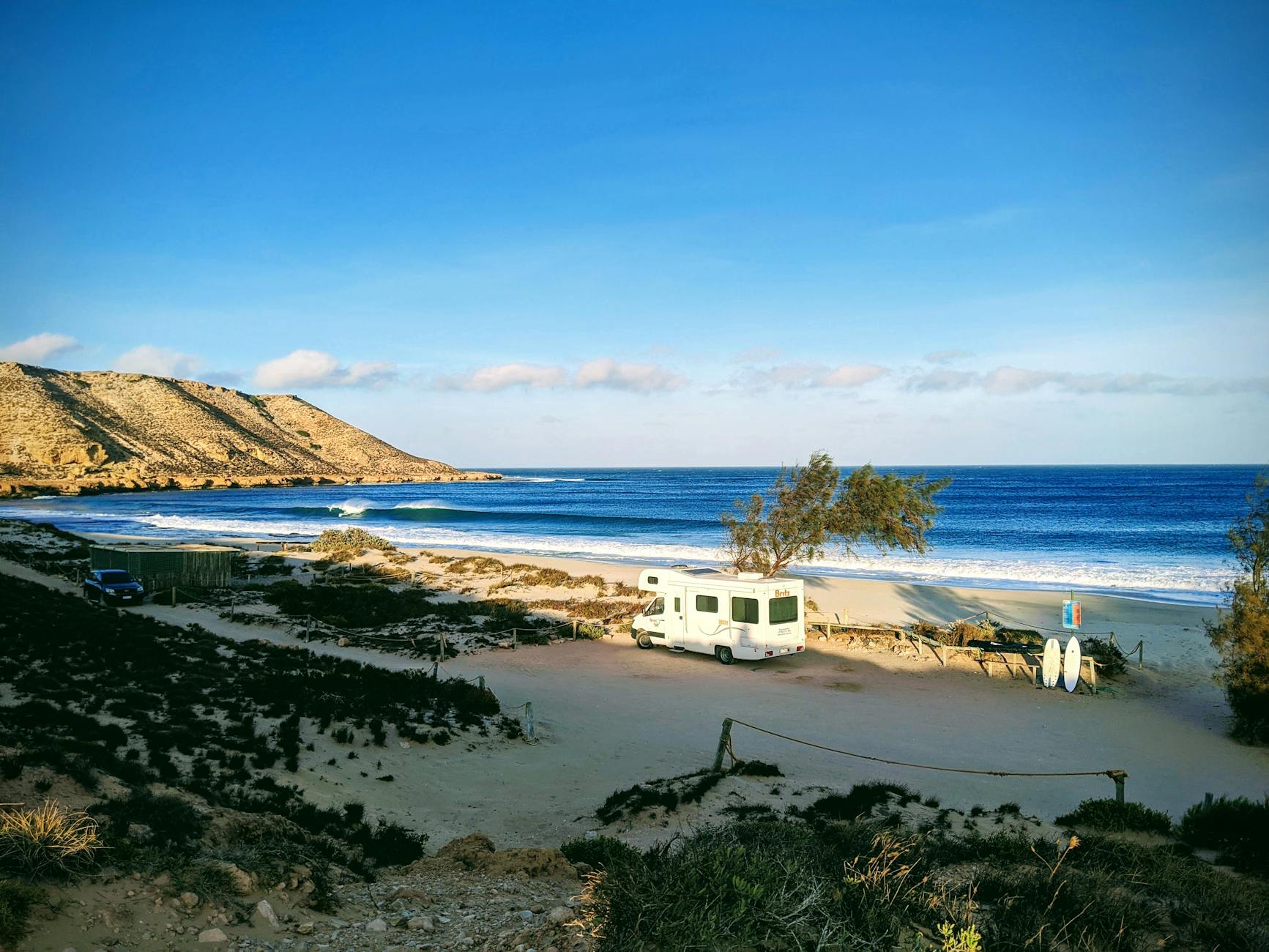 Idyllic coastal camping scene with ocean view in Western Australia.