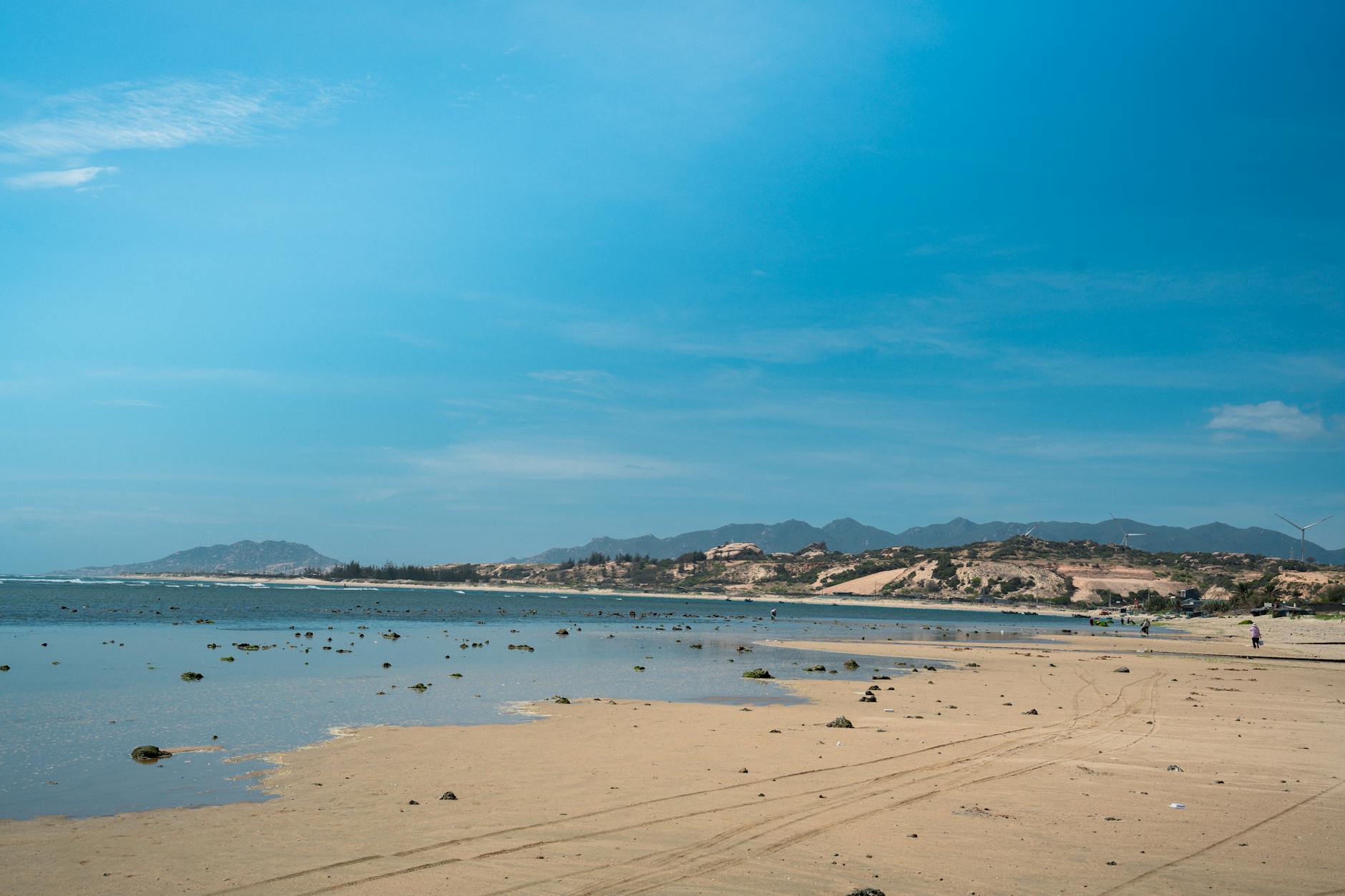 Stunning beach view under a clear blue sky in Central Vietnam, offering a tranquil coastal escape.