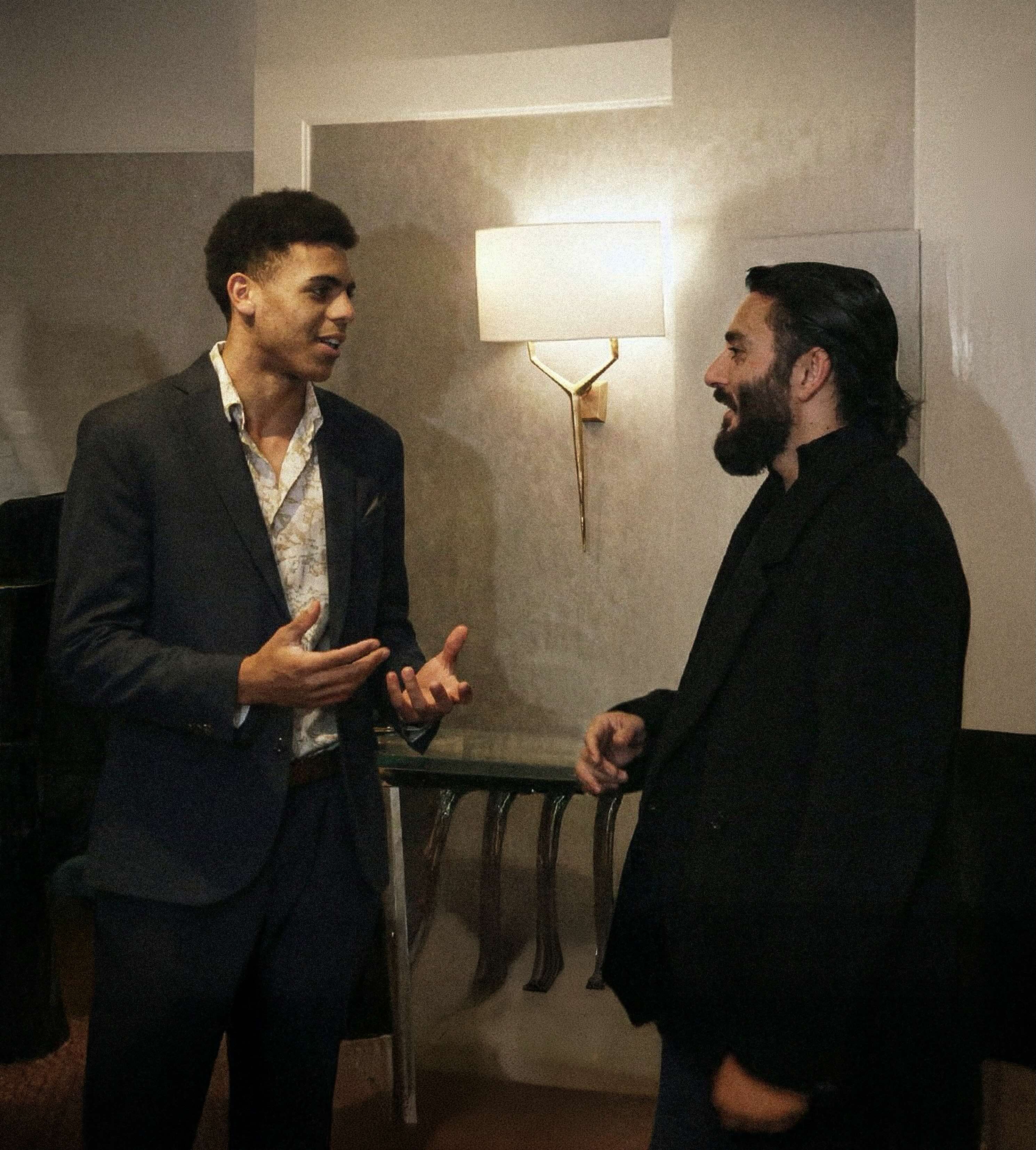 Two men conversing