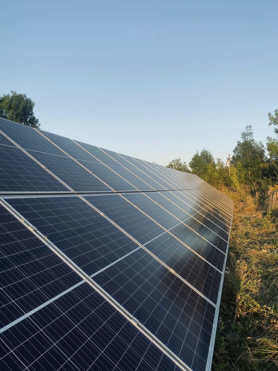 Solar panels installed on a residential roof, clear sky