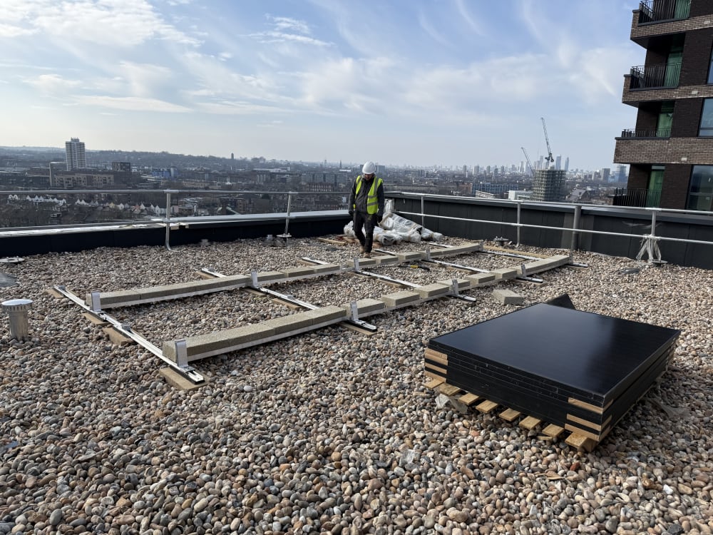 K2 S-Dome mounting rails laid with Jinko panels ready for install on Block A roof, Old Kent Road, Southwark, London.