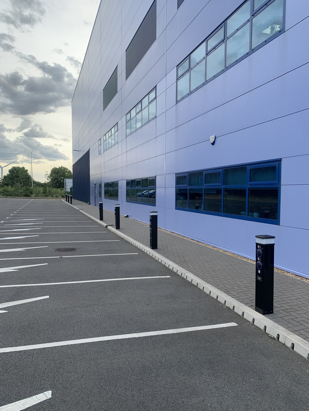 Completed Rolec EV charging pedestal installed in the car park with the Zeus Packaging office building at Biggleswade.