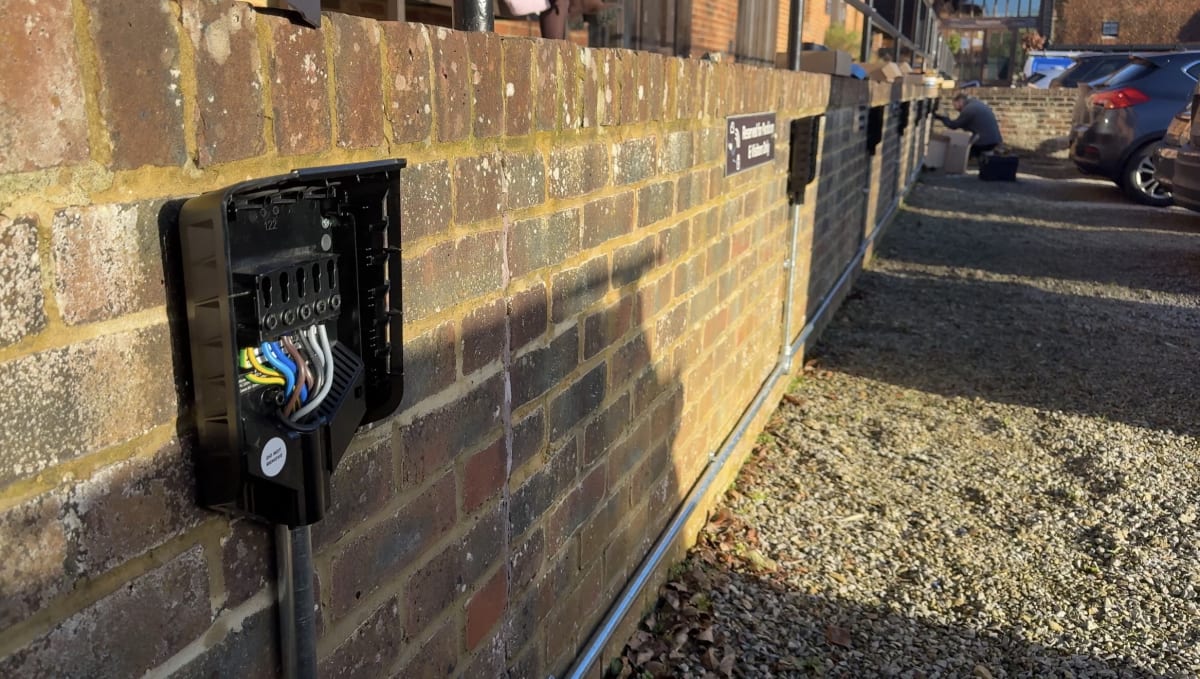 Easee charger backplate open during first fix wiring with galvanised conduit at Purdicom, Wantage.