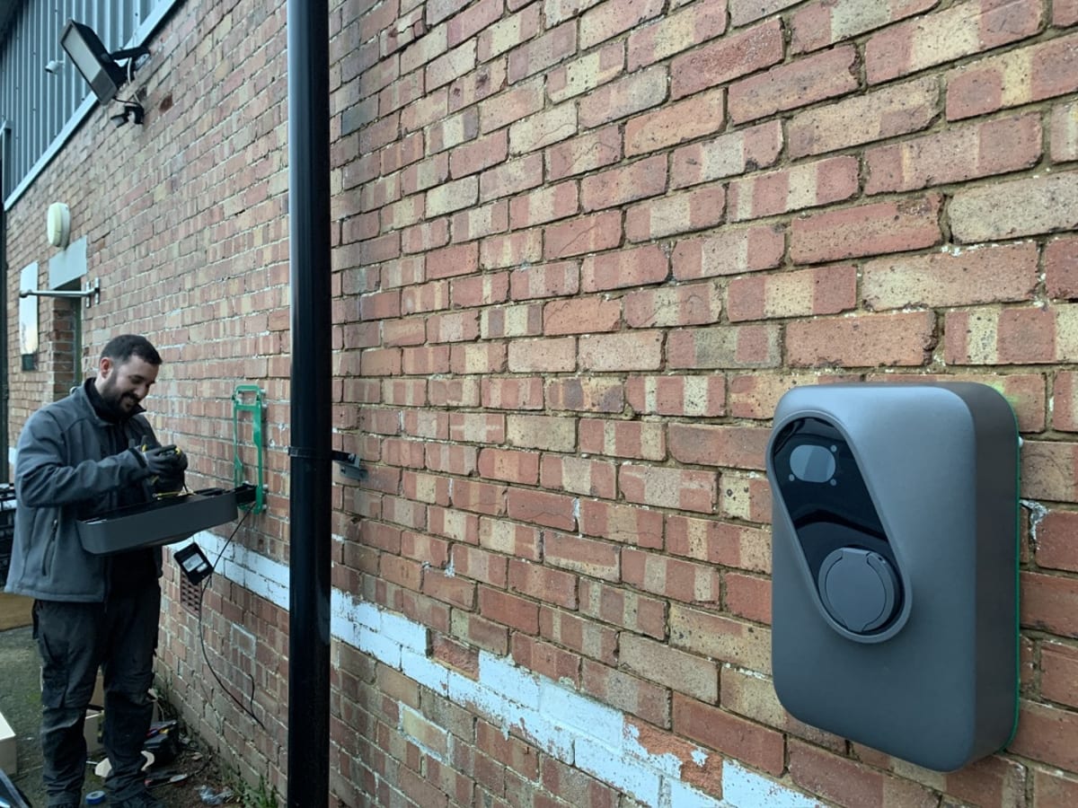 Engineer commissioning a Landis+Gyr Inch Pro charger and RFID reader at Route One distribution centre, Acton Turville