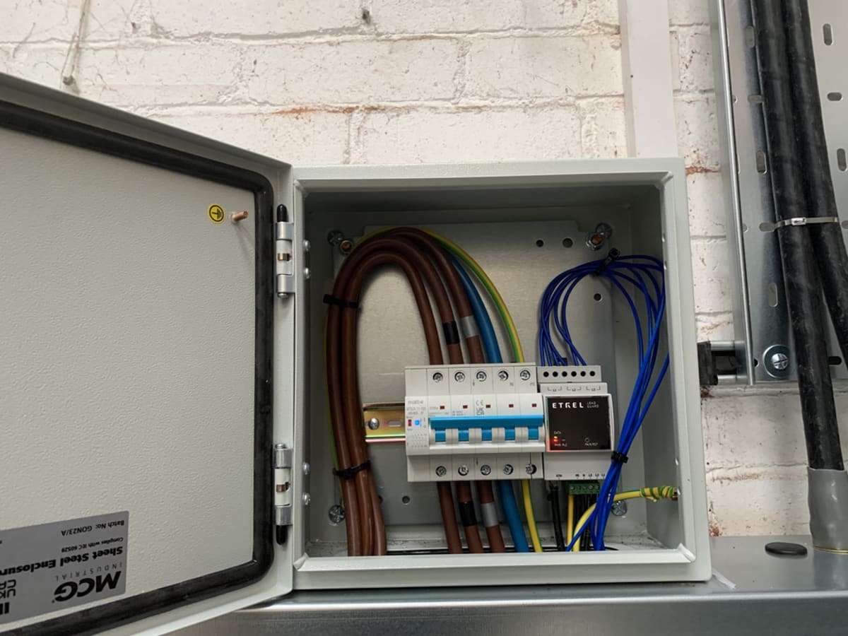 Etrel Load Guard with solar monitoring installed in a steel enclosure at Route One, Acton Turville