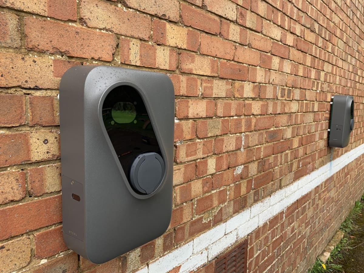 Two Landis+Gyr Inch Pro chargers with RFID access control on the brick wall at Route One, Acton Turville
