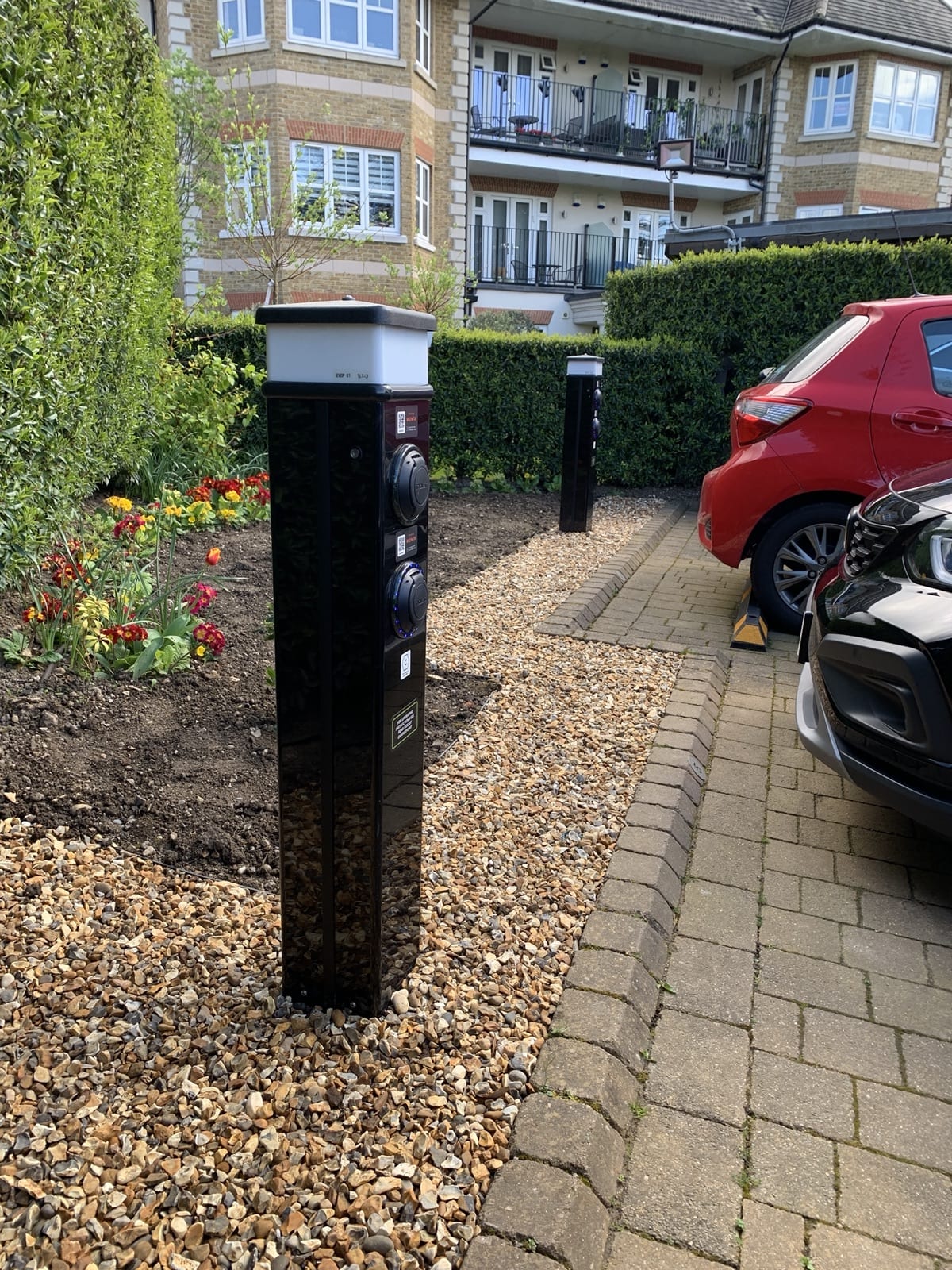 Rolec dual bollard charger with integrated LED lighting and shingle reinstatement at Ashby Lodge, Hendon