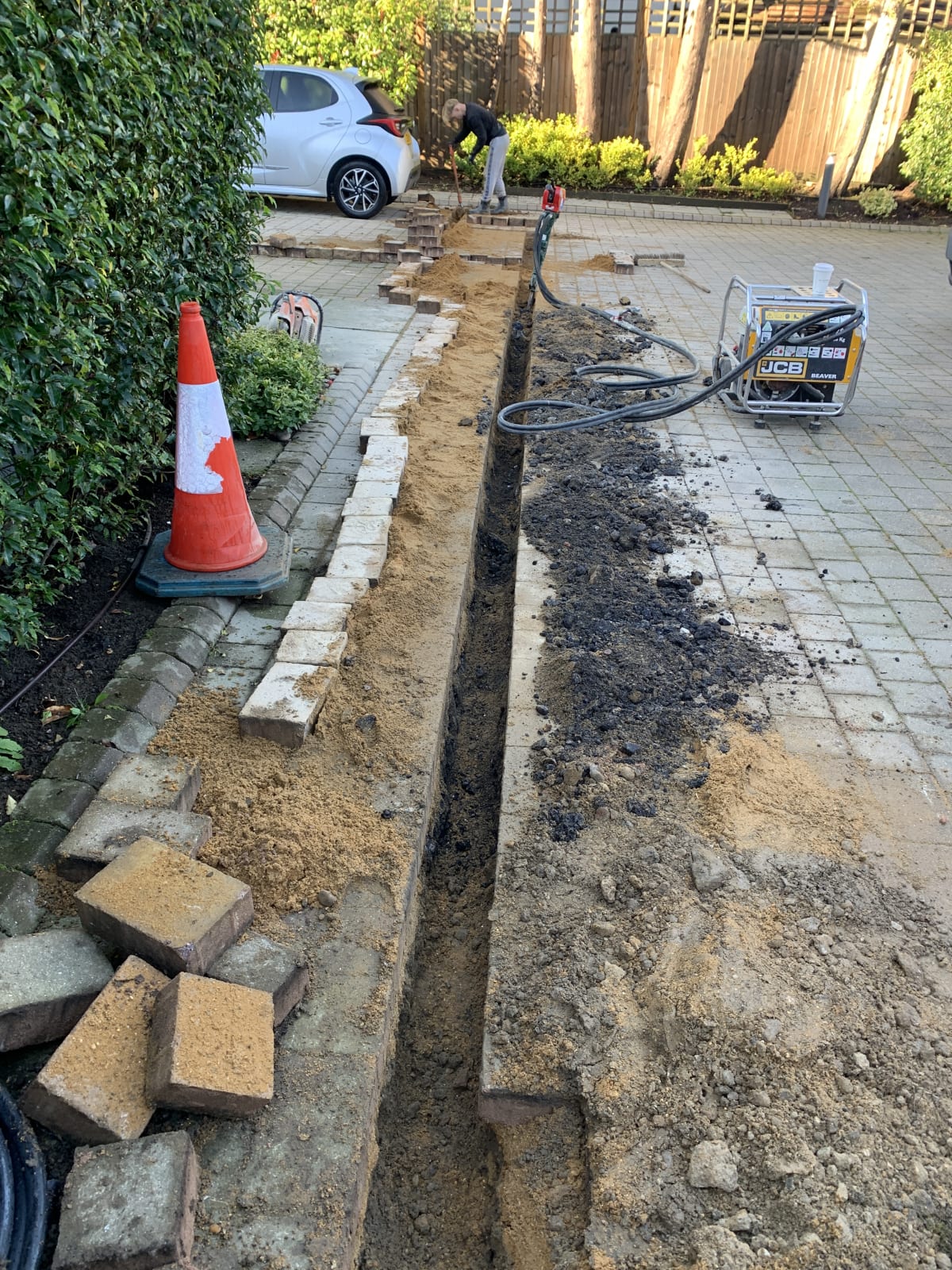 Trenching and cable installation during EV charger groundworks at Ashby Lodge, Hendon
