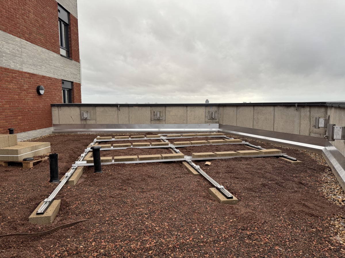 K2 S-Dome ballasted mounting rails on the 13th floor flat roof at Brooke House, Acton, ready to receive panels.