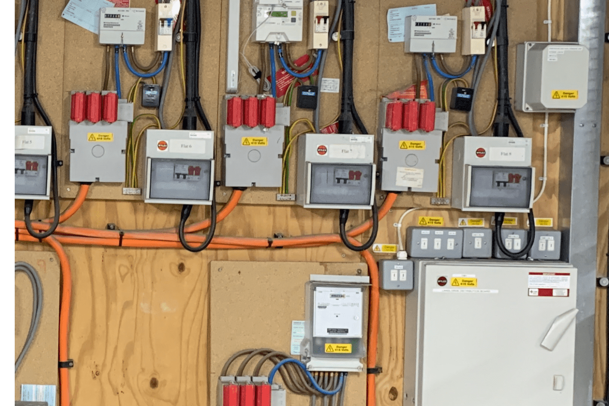 Individual flat metering and isolator switches for EV charger circuits at Denver Court apartments, Hendon