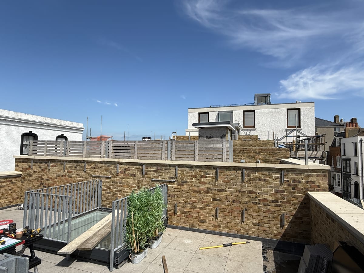 Rooftop terrace at Fort Mount, Margate, Kent, prior to the wall-mounted solar PV installation on the coping stone wall.