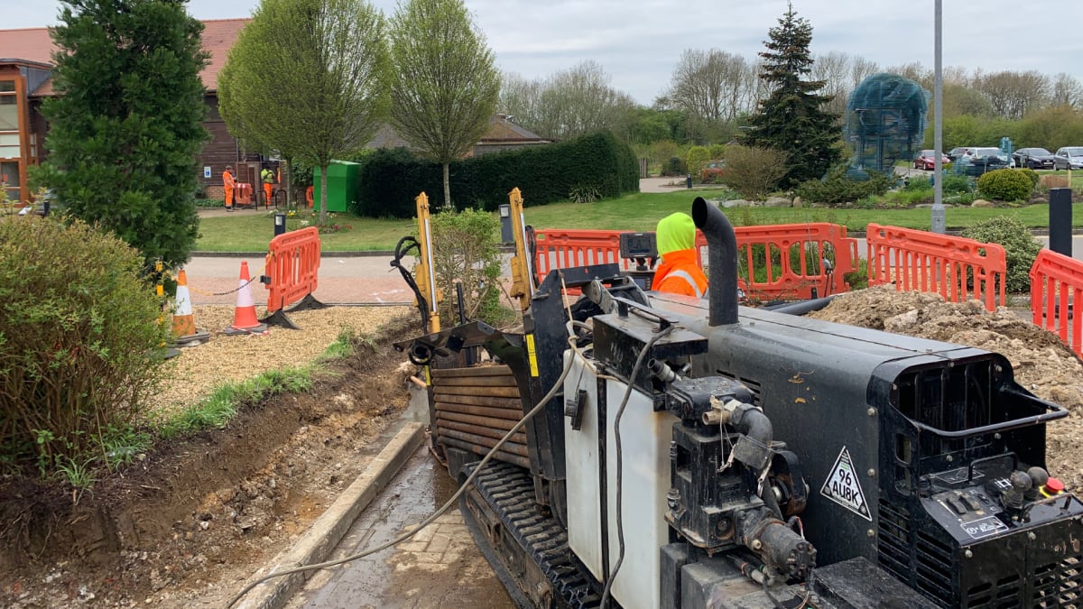 Horizontal directional drilling rig installing underground cable ducts at The Hospice of St Francis, Berkhamsted