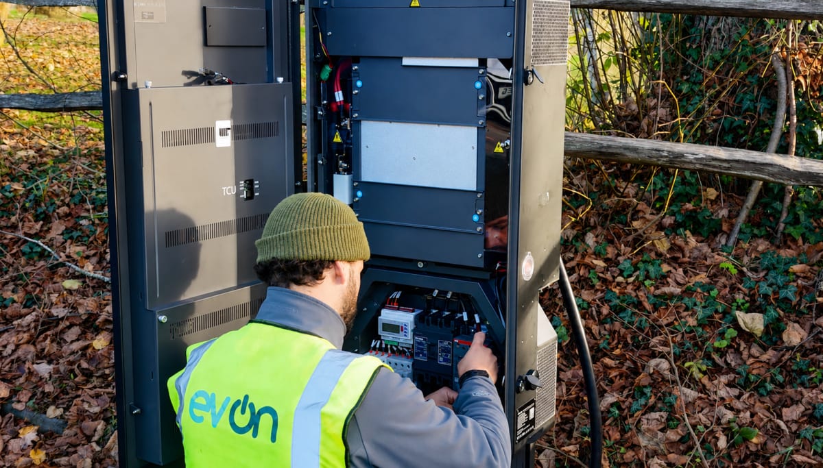An evon engineer wiring the internals of a Rolec EV charger during installation