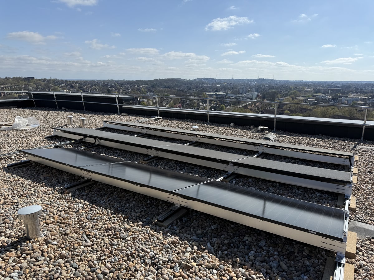 Completed 11-panel Jinko Tiger Neo solar array on the upper roof at 840 Old Kent Road, Southwark, London.