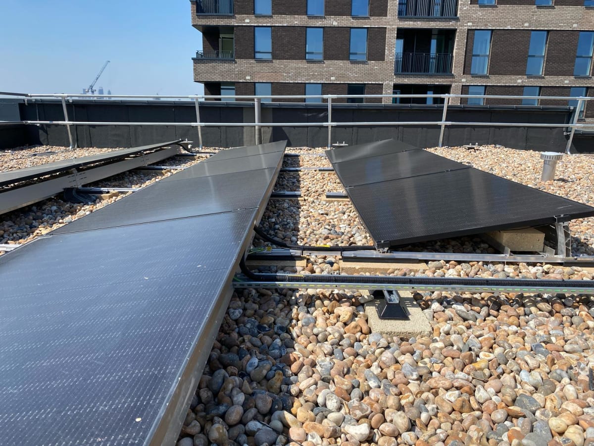 Close-up of Jinko Tiger Neo solar panels at 10 degree tilt on the Block A roof at Old Kent Road, Southwark.