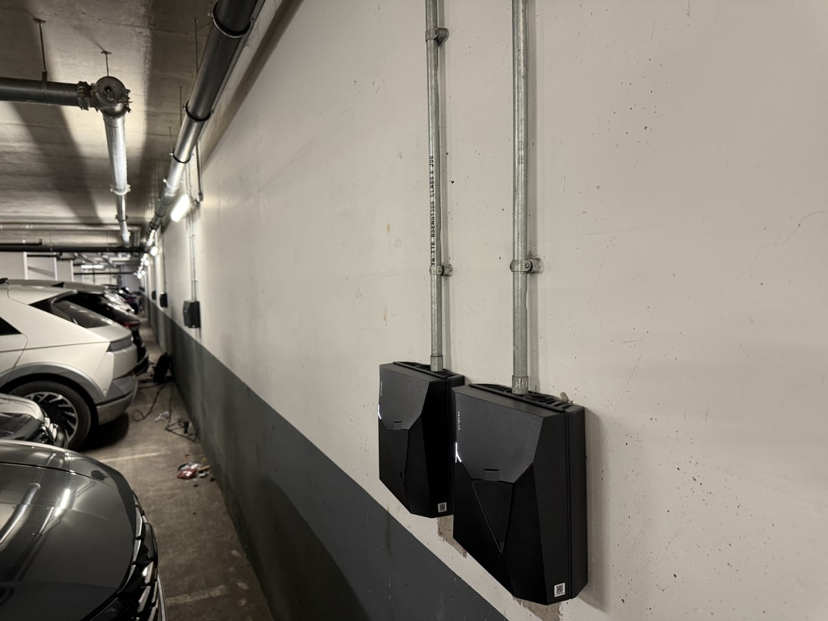 Two Nexblue Point 2 7kW chargers installed on the underground car park wall at The Avenue, Kilburn, London.