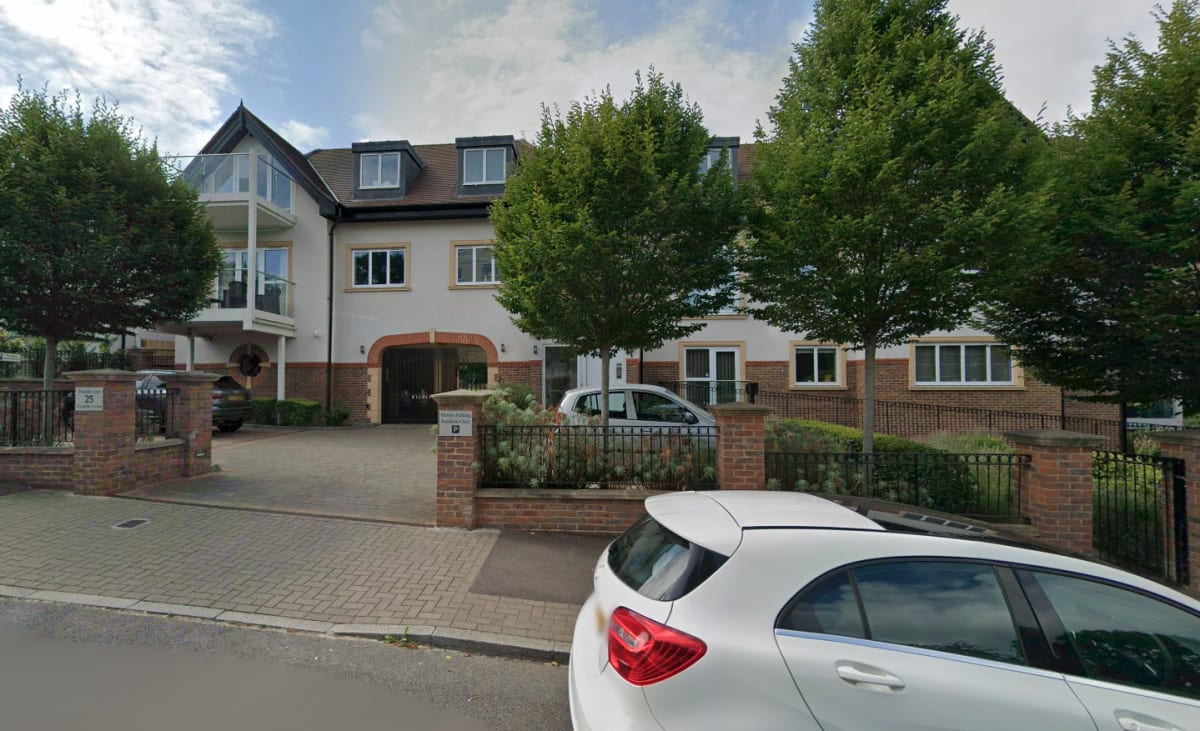 Street view of Wickliffe Court residential development showing the gated entrance and landscaped gardens in Hendon, London