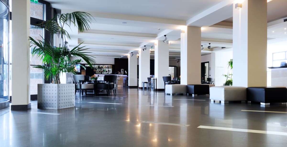 Bright modern hotel lobby with lounge seating and bar, a UK hospitality venue suited to guest EV charging