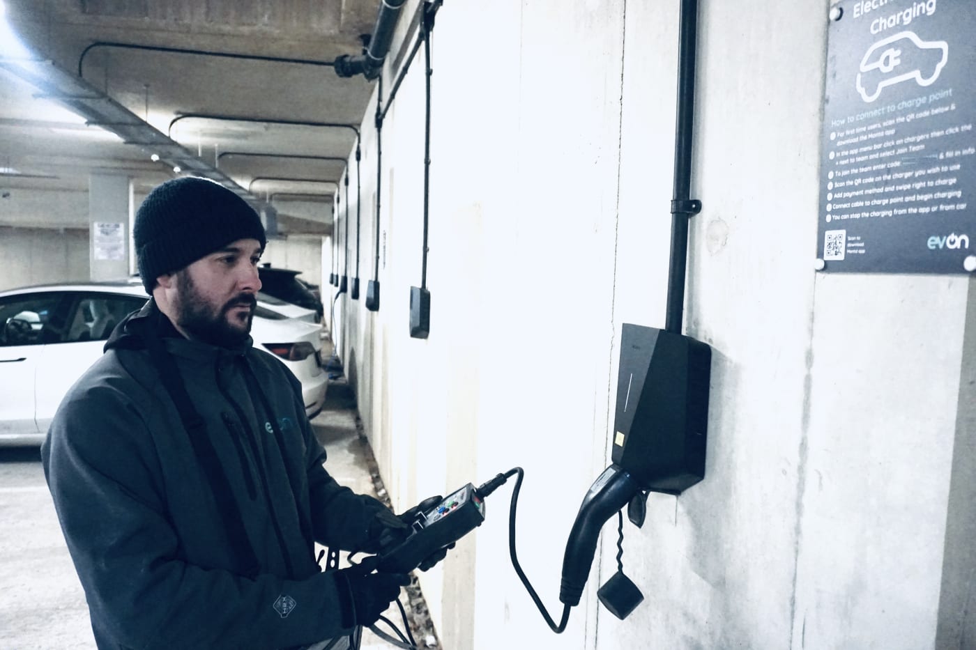 evon engineer carrying out maintenance on an Easee charger at Millbrook Park