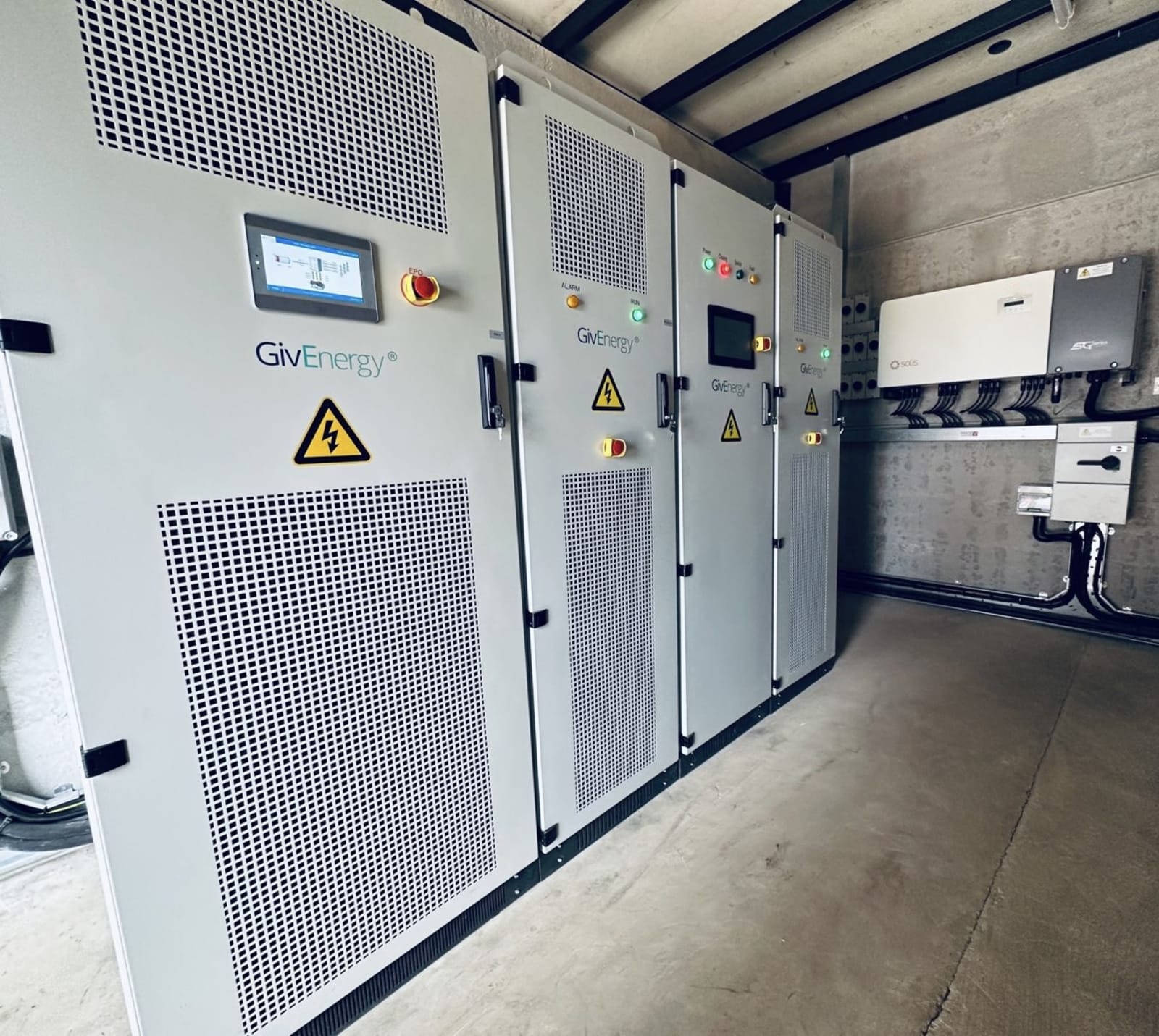 GivEnergy commercial battery storage cabinets and a Solis inverter in a containerised unit