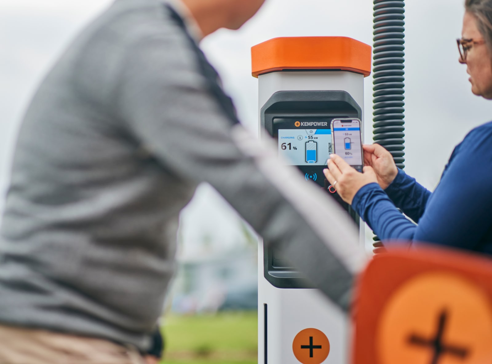 Close up of a Kempower DC fast charger display showing real time charging status and power delivery.