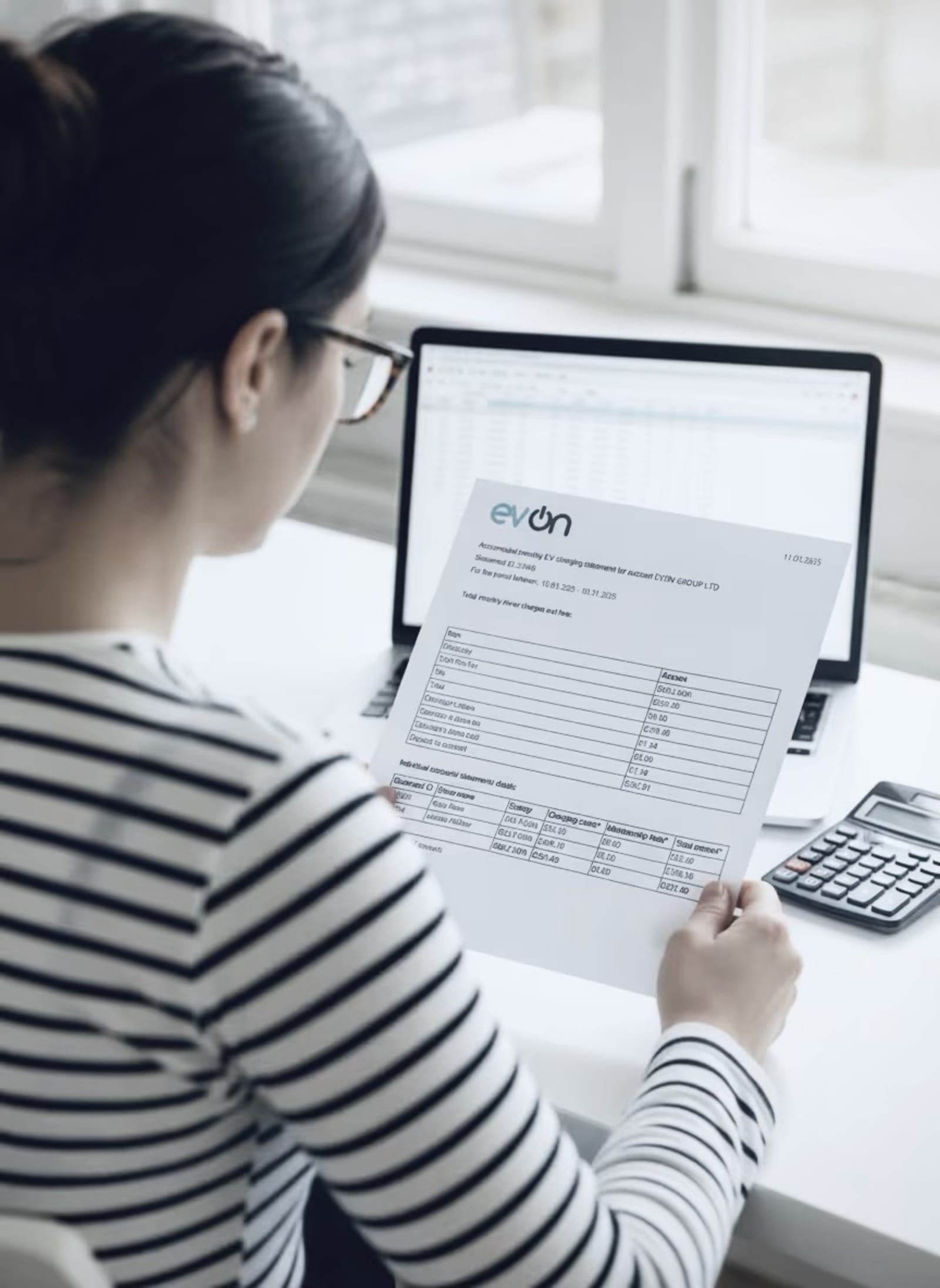 A finance team member reviewing an evon automated EV charging billing statement