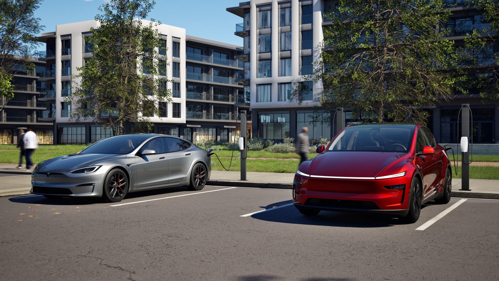 Two Tesla cars parked at Tesla Destination Charging points in a residential apartment car park.