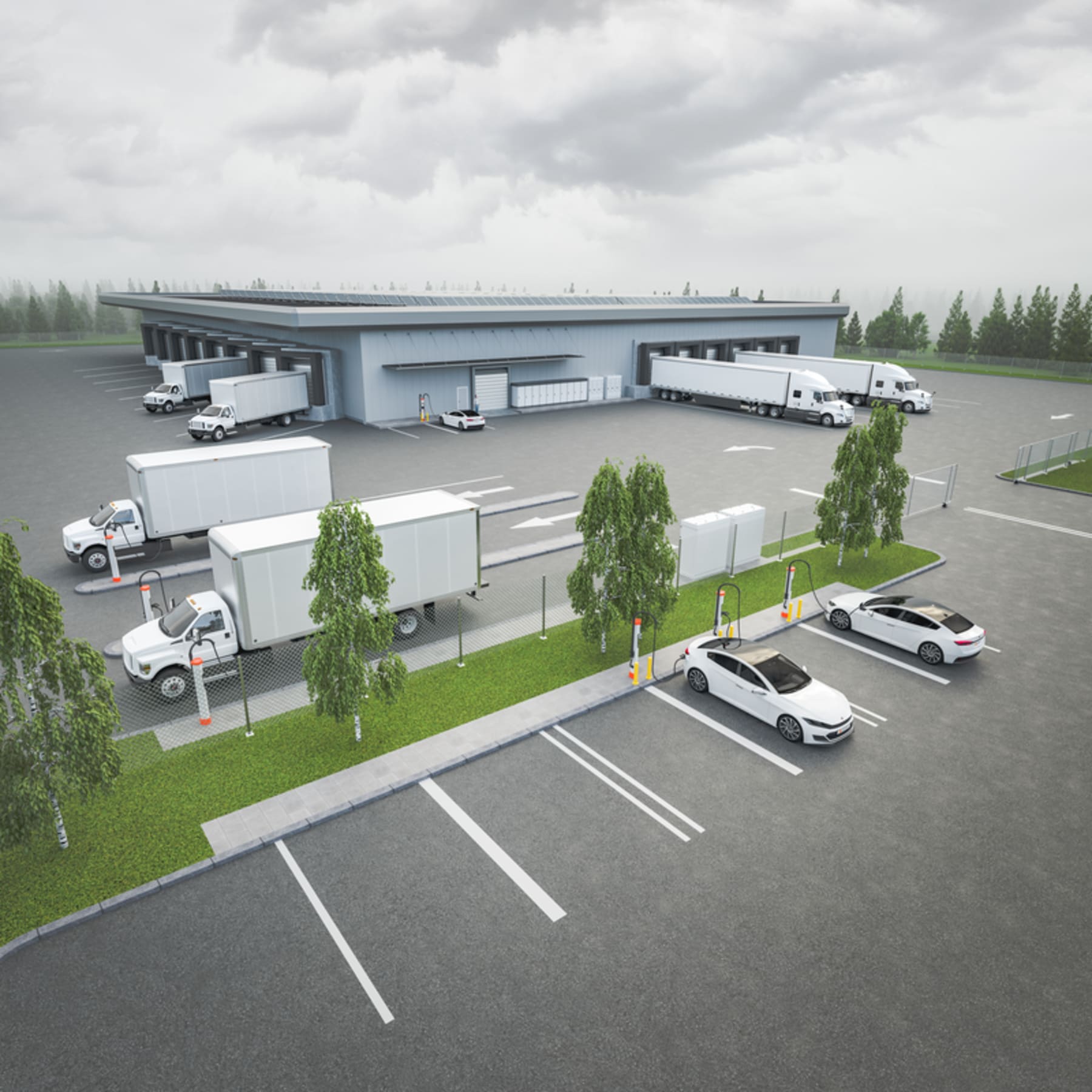 Aerial view of logistics depot with electric vans charging at multiple stations overnight