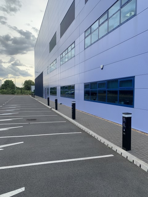Completed Rolec EV charging pedestal installed in the car park with the Zeus Packaging office building at Biggleswade.