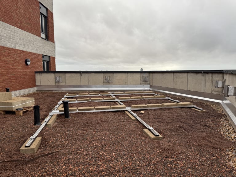 K2 S-Dome ballasted mounting rails on the 13th floor flat roof at Brooke House, Acton, ready to receive panels.