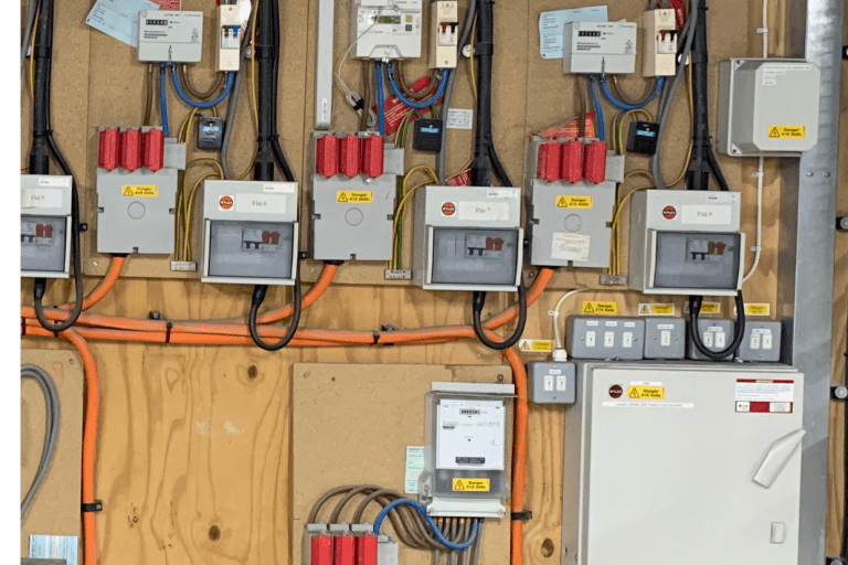 Individual flat metering and isolator switches for EV charger circuits at Denver Court apartments, Hendon