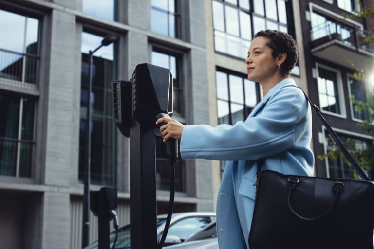 Easee EV charger installed at a residential apartment building with electric vehicle plugged in