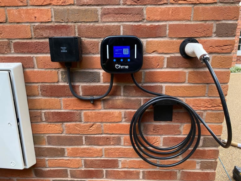 Ohme Home Charger Installed Brick Wall Tethered Cable
