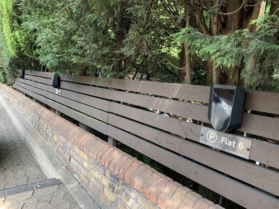 Multiple Easee chargers along perimeter fence at Hill Court, Highgate