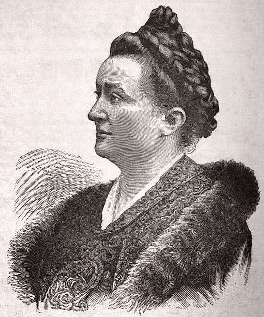 Gravure ancienne représentant une femme de profil, vêtue d’une tenue élégante avec une étole en fourrure et les cheveux relevés.