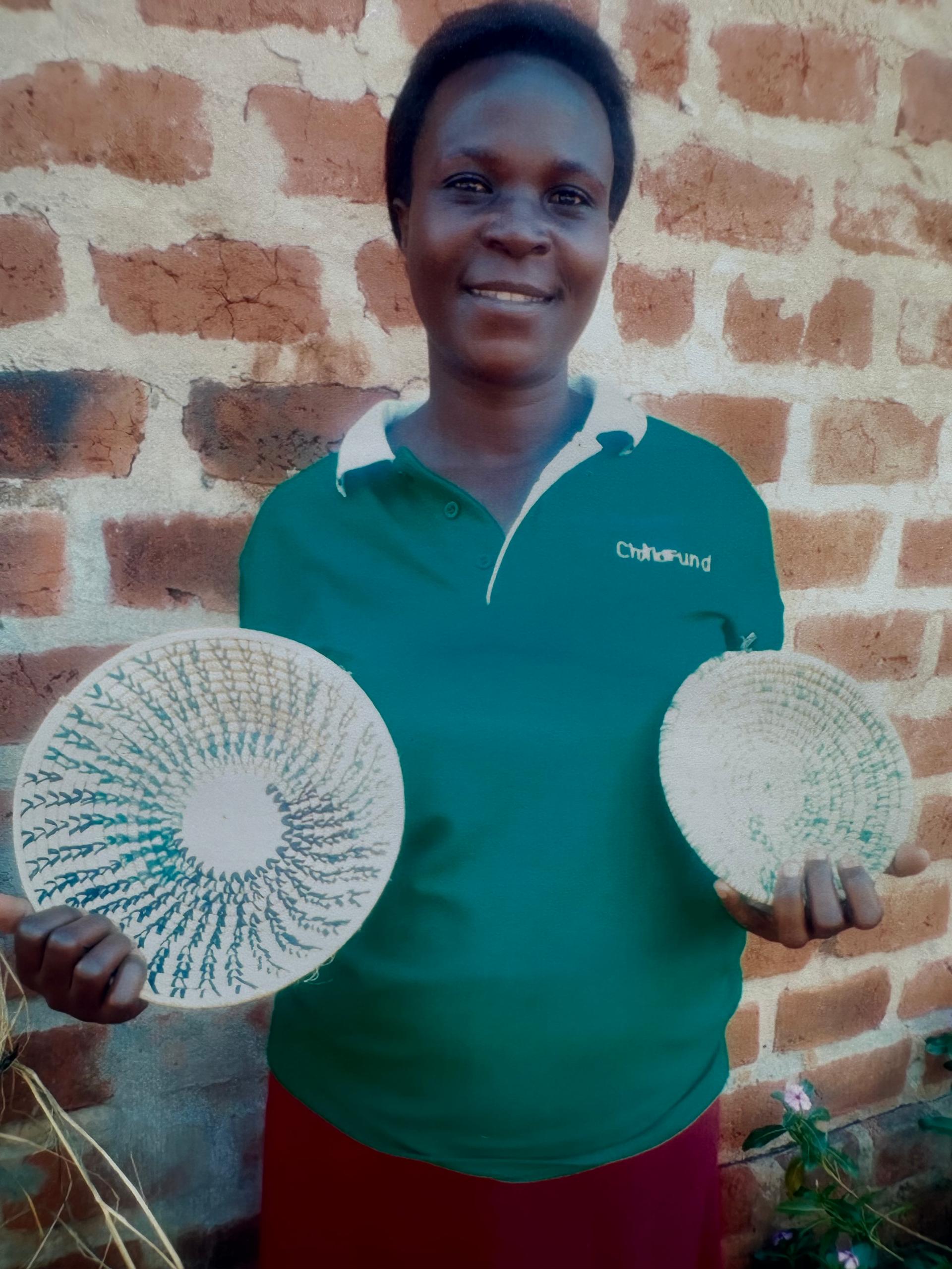 Ugandan artisan with woven basket