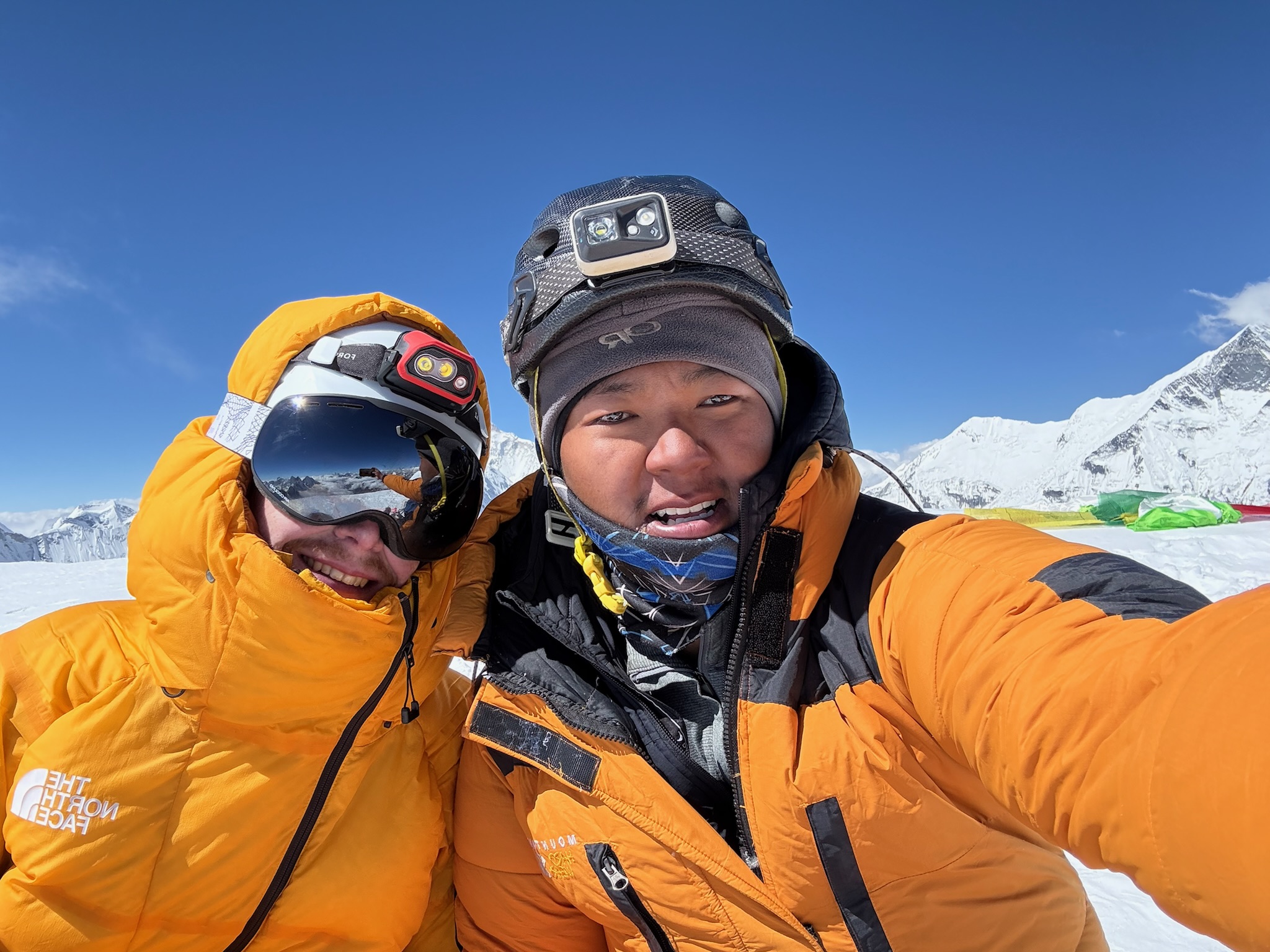 French Climber Summit of Island Peak 6,189m — Everest Region, Nepal French climber posing triumphantly at the summit of Island Peak (Imja Tse) at 6,189m with panoramic Himalayan views in the Everest region, Nepal