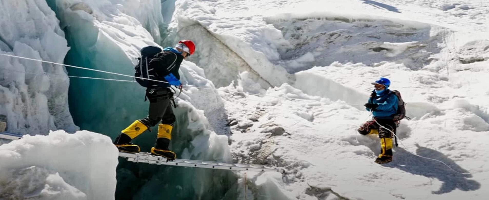 Climbers using fixed ropes on the Island Peak summit headwall