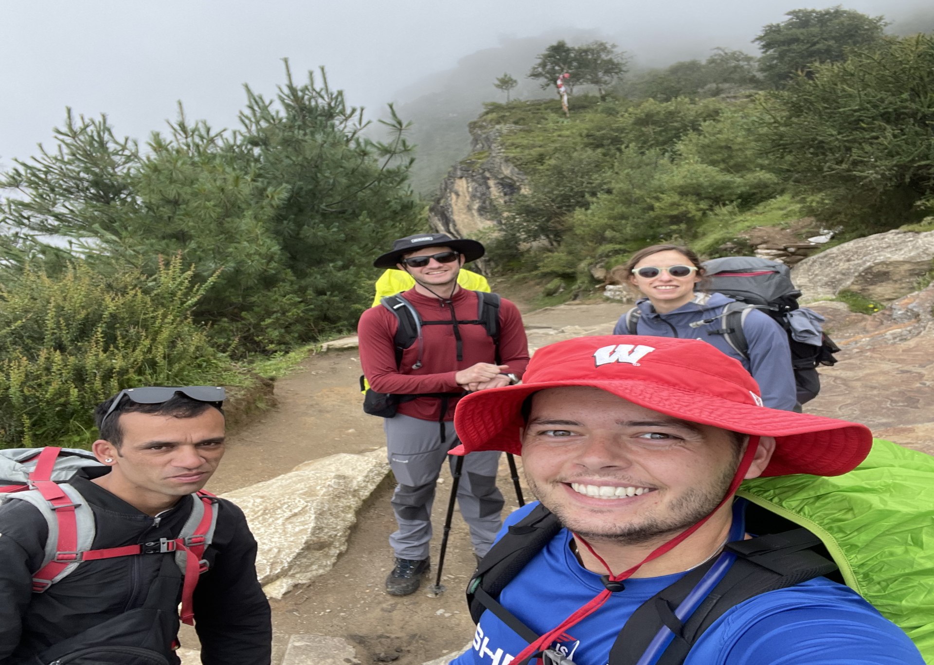 Trekker with a loaded backpack hiking the Everest Base Camp approach trail