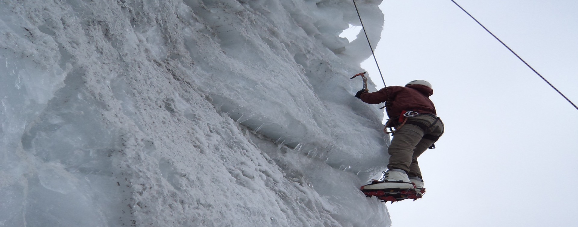island-peak-basecamp-jumar-training-session Guide demonstrating jumar and crampon technique during Island Peak base camp training