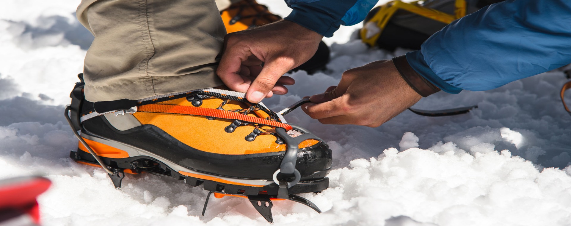 Climber's crampons on hard blue ice of the Island Peak headwall