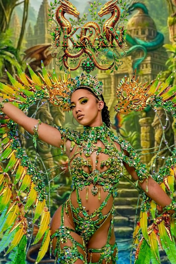 Woman in green and gold Ikran dragon-themed carnival costume with feathered wings and headpiece at Notting Hill Carnival 2026
