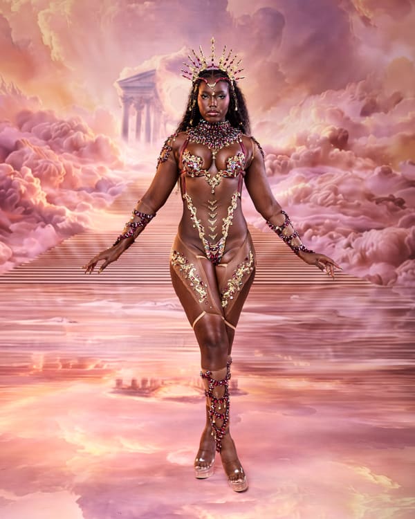 Female performer in gold beaded Athenyx monokini costume with crown and purple accents by Nyla Modeste for Tribe at Trinidad Carnival 2027