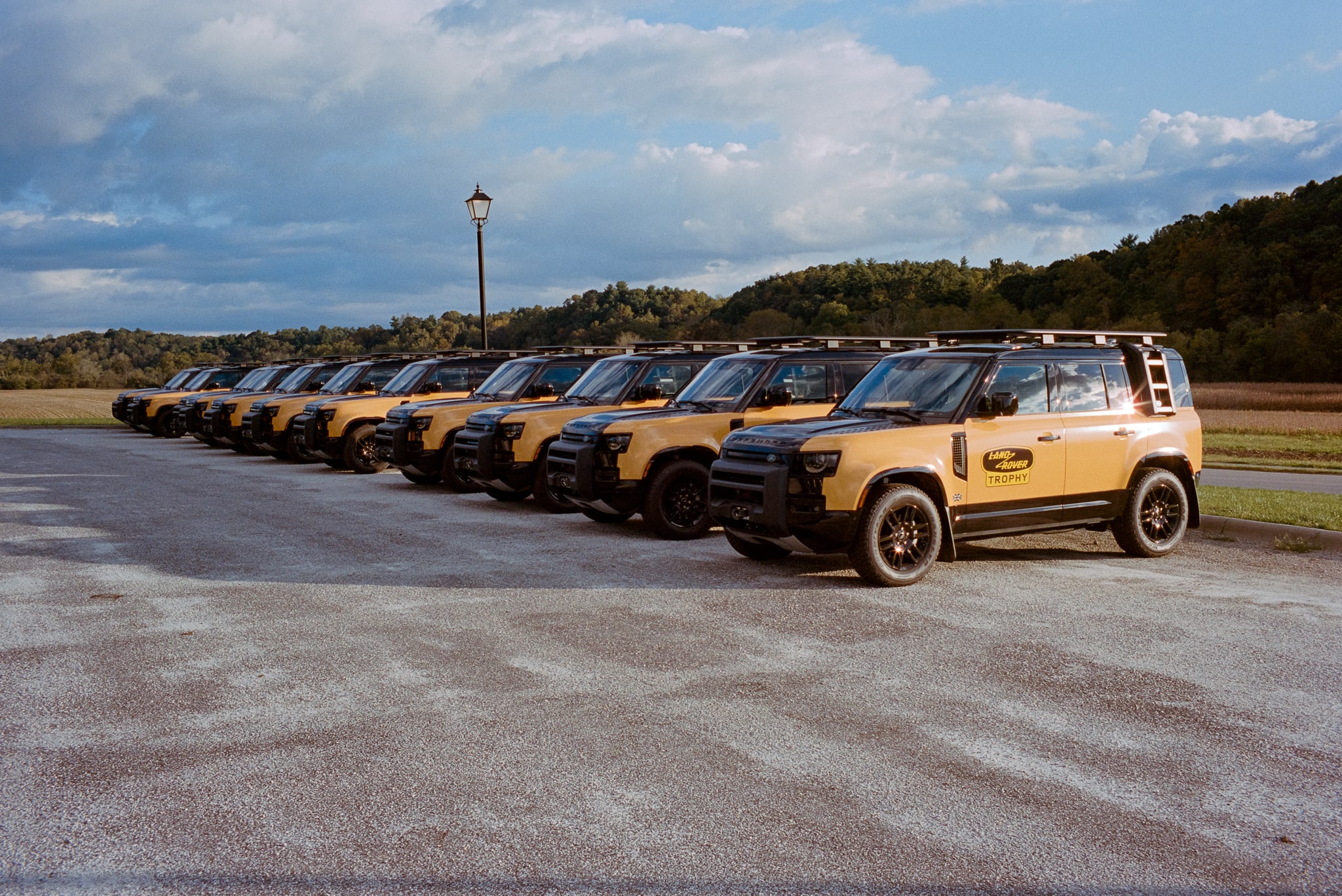 row of identical yellow trucks