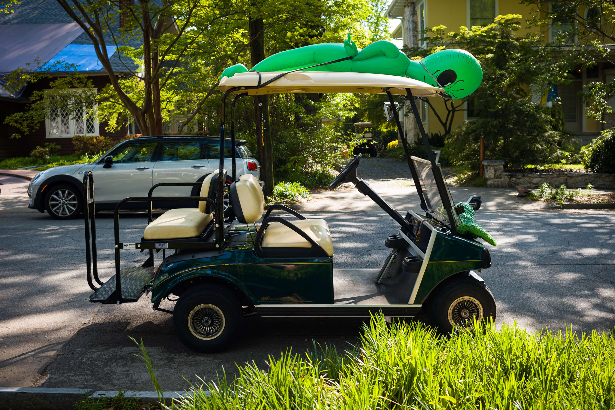 golf cart with inflatable alien tied to the top