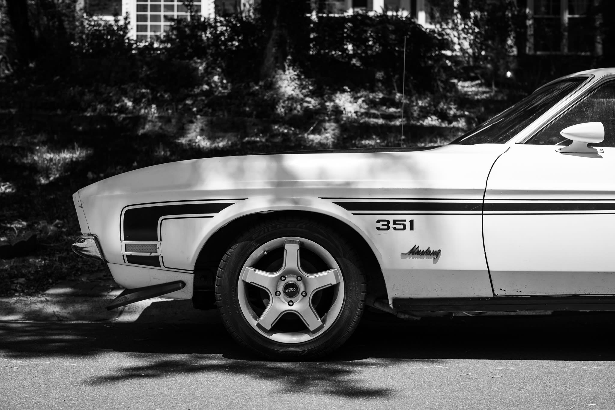 photograph of a 1971 351 Boss Mustang parked on a neighborhood street