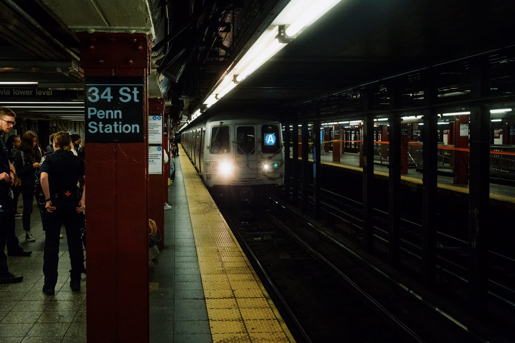 the a train approaches at the 34th street penn subway station