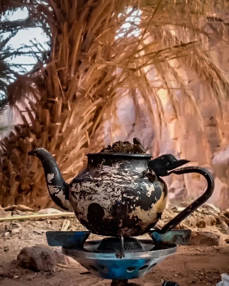 Moroccan mint tea served in a desert oasis setting