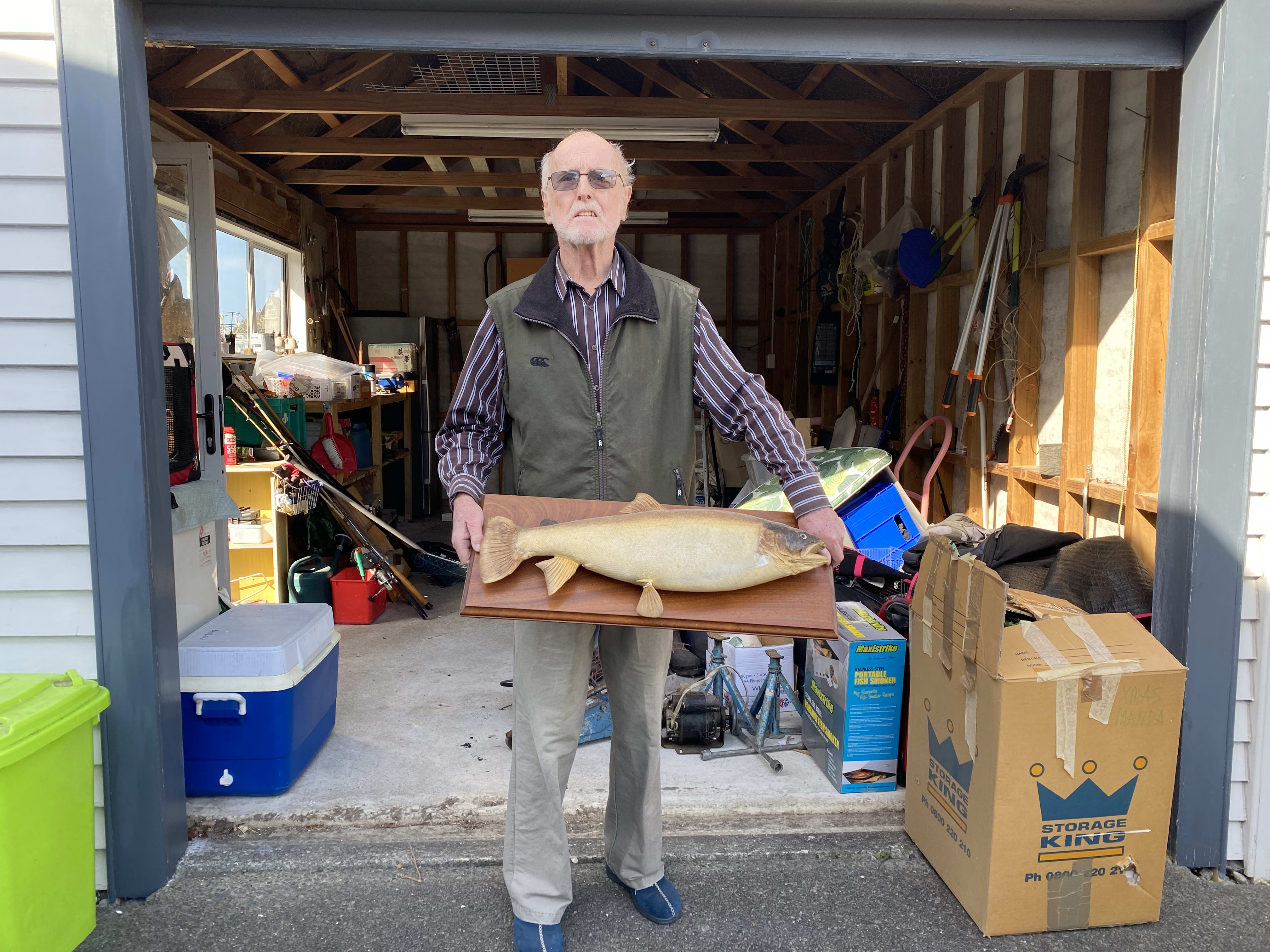 Clearing out the garage at Petone... and a last hurrah for Graeme's dad's old trout trophy.