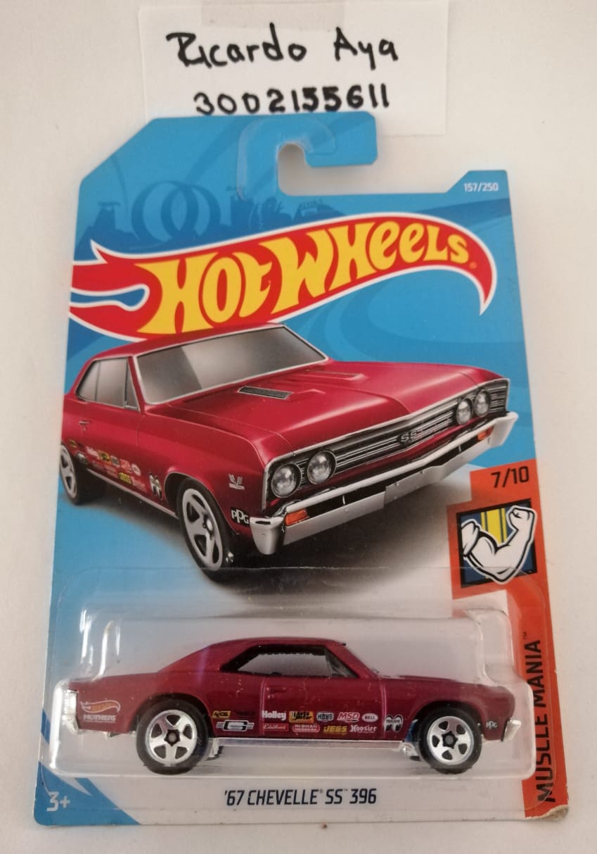 Front of satchel with blue canvas body, black straps and handle, drawstring top, and front zipper pouch.